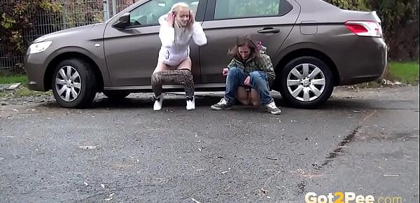  Blonde And Brunette Squat And Piss Together